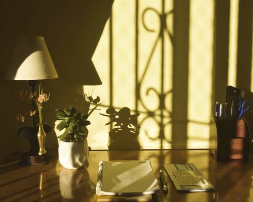 Soft light illuminating a neat work table setting the mood for relaxation