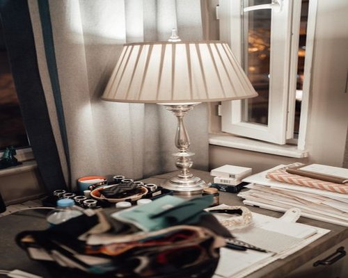 A well-organized work desk with soft warm lighting